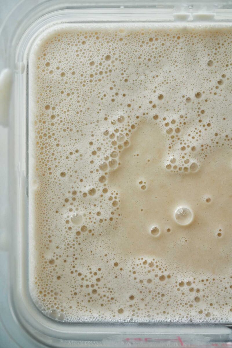 Frothy liquid in a square container.