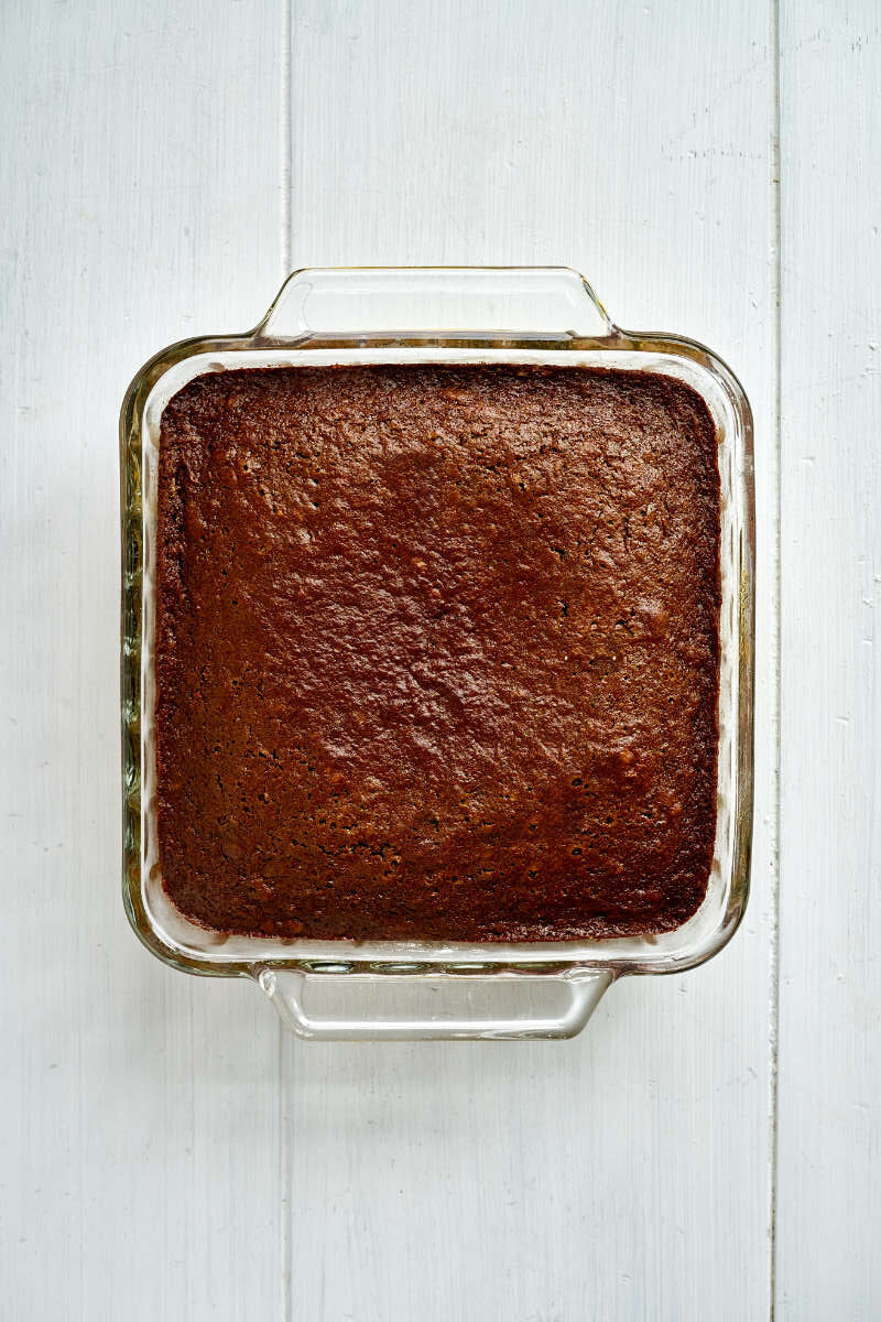 Cake in a square glass baking dish.