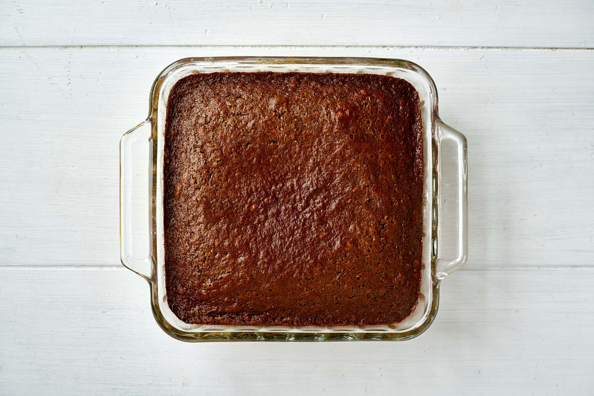 Cake in a square glass baking dish.