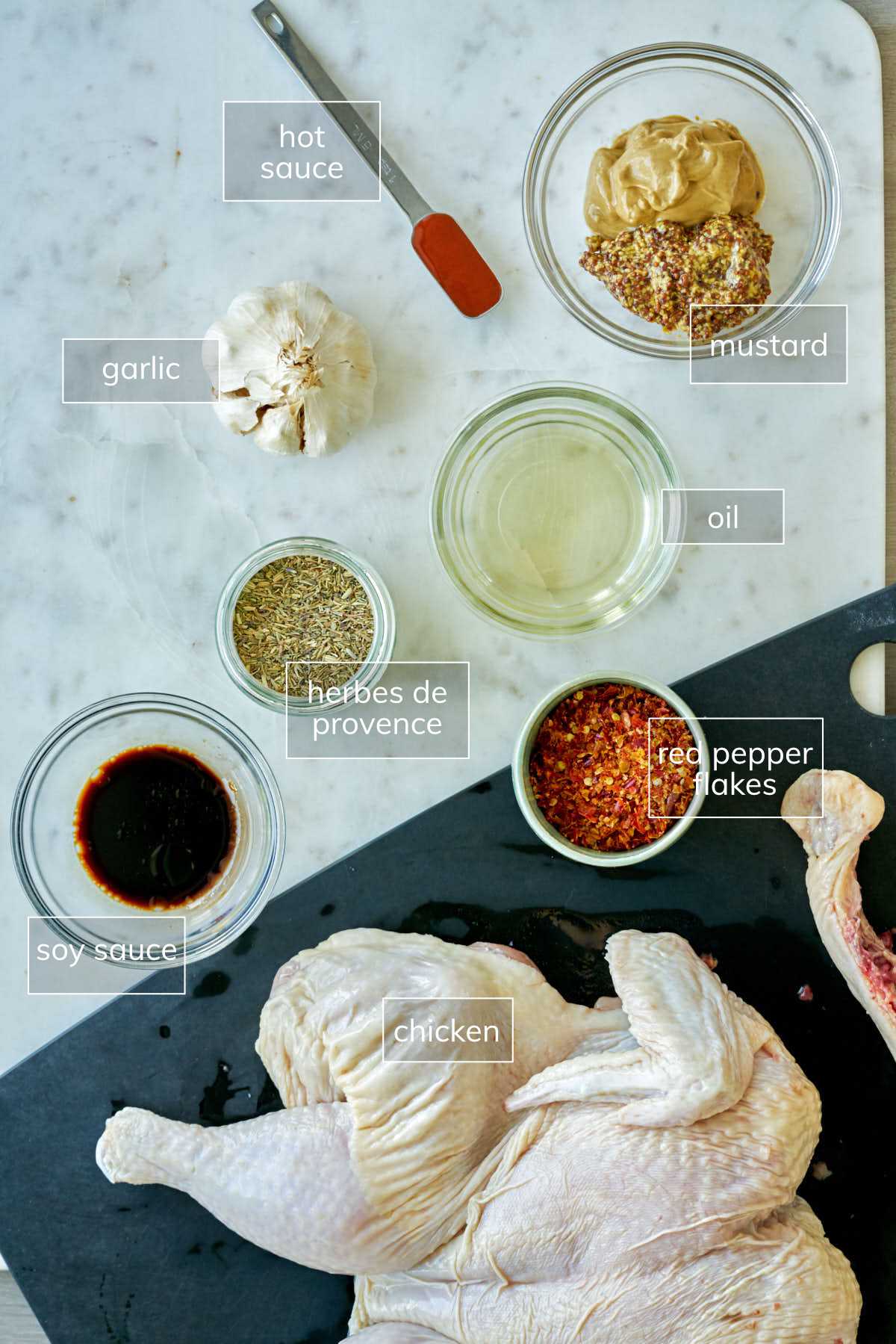 Ingredients on a white countertop for mustard chicken.