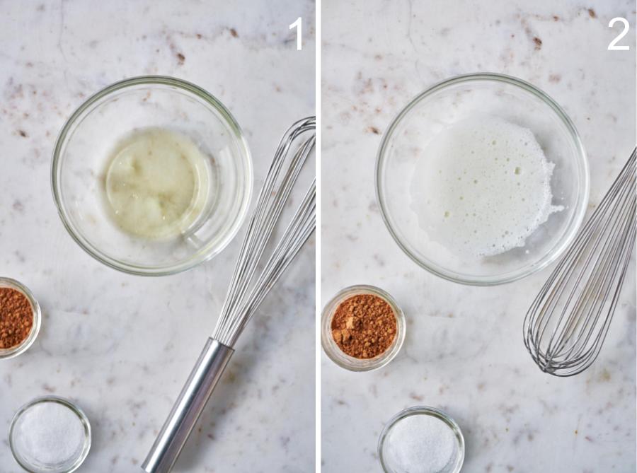 Whisking egg whites in a clear bowl.