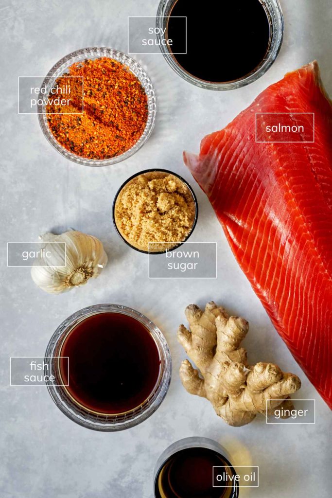 Ingredients for sweet and spicy salmon including soy sauce, garlic, brown sugar, and ginger. 