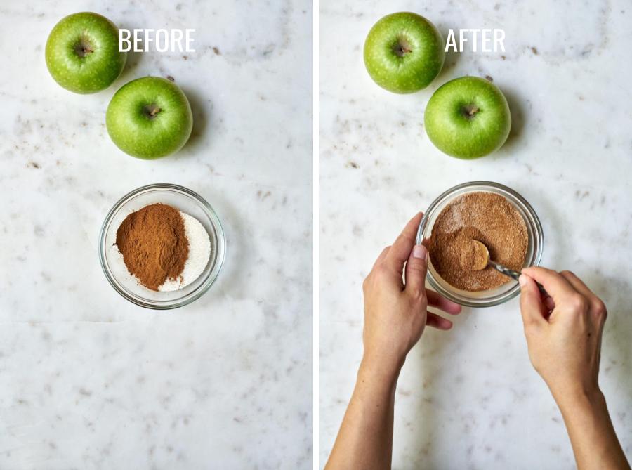 Mixing cinnamon and sugar in a bowl next to two green apples.