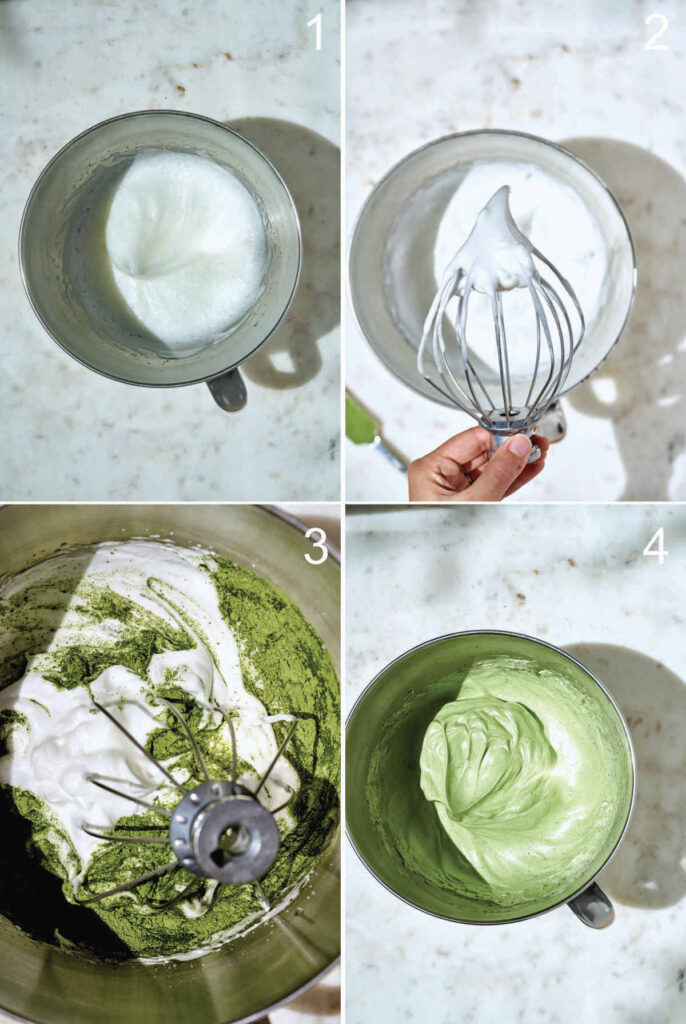 Mixing matcha into meringue in a standing mixer bowl.