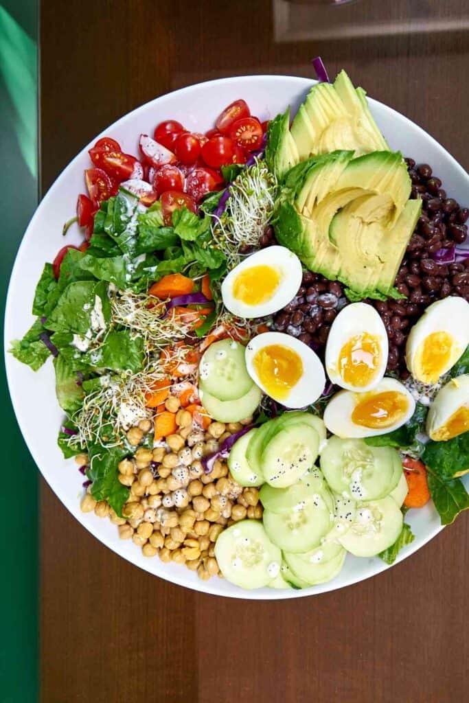 Top view of a meal salad with ingredients separated for easy picking.