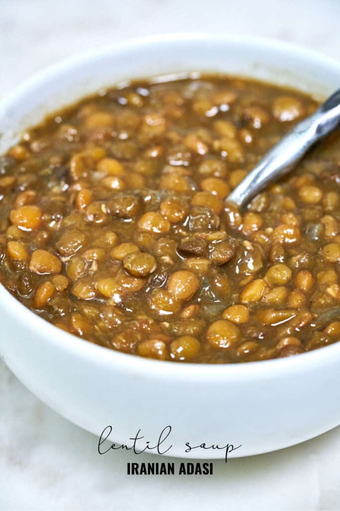 Bowl of lentils with a spoon.