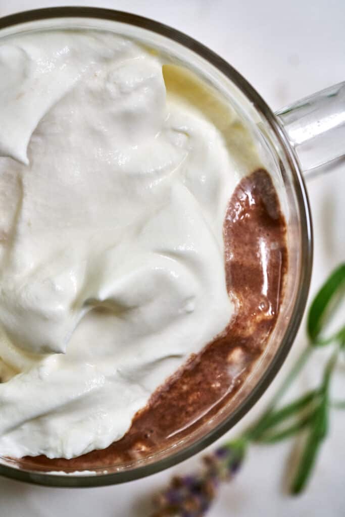 Top view of hot chocolate with whipped cream.