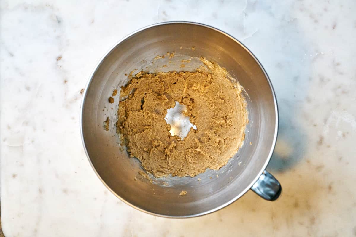 Stand mixer bowl with butter and sugar beaten together.