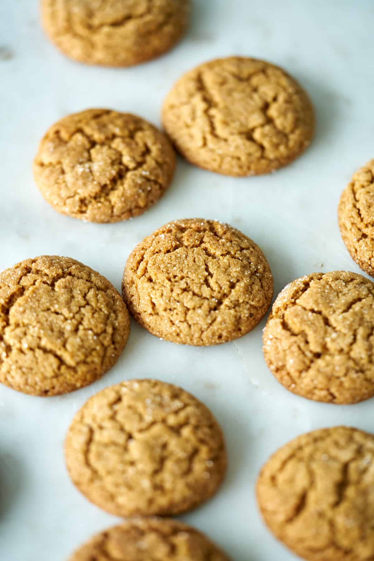 Cookies spread out on a white countertop.