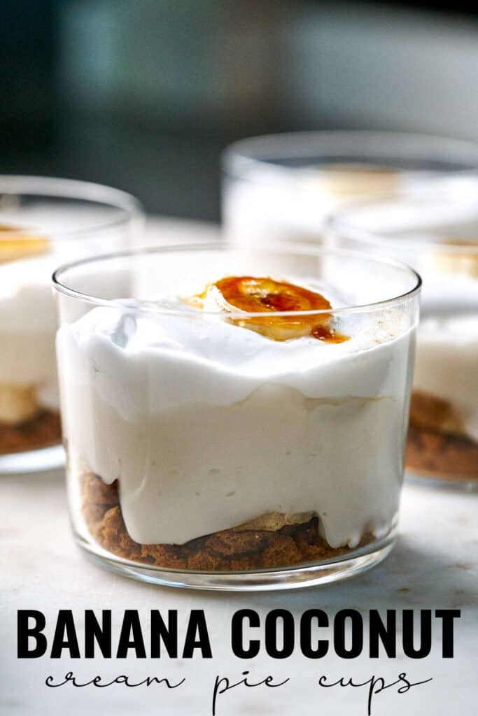 Close up of banana cream pie cup topped with a bruleed banana slice with title text.