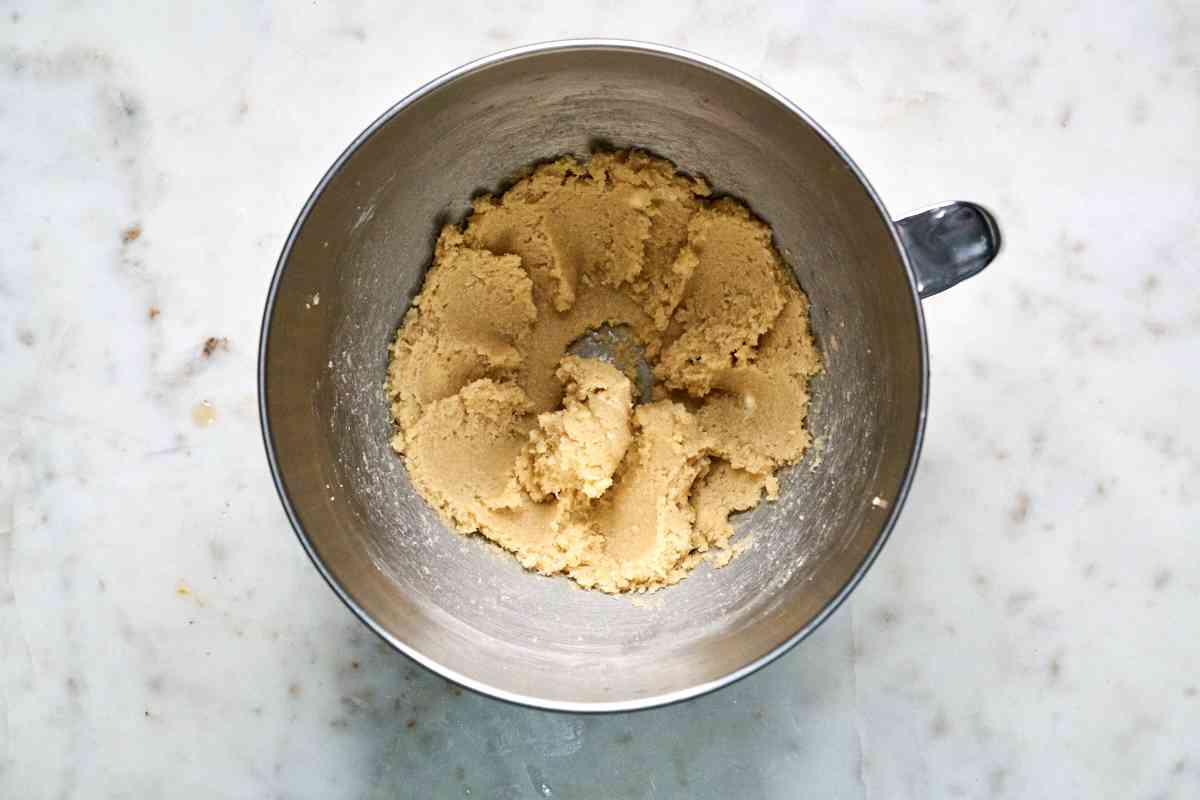 Butter and sugar creamed in a mixing bowl.