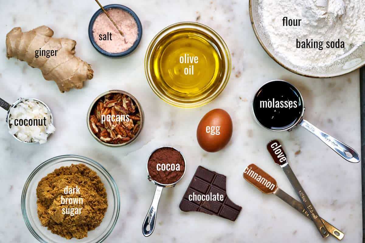 Labeled ingredients for chocolate ginger cake on a white countertop.