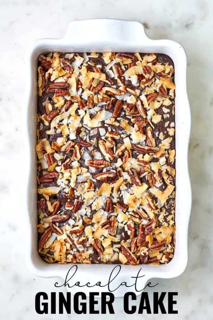 Top view of cake in white dish topped with coconut and pecans with title text.