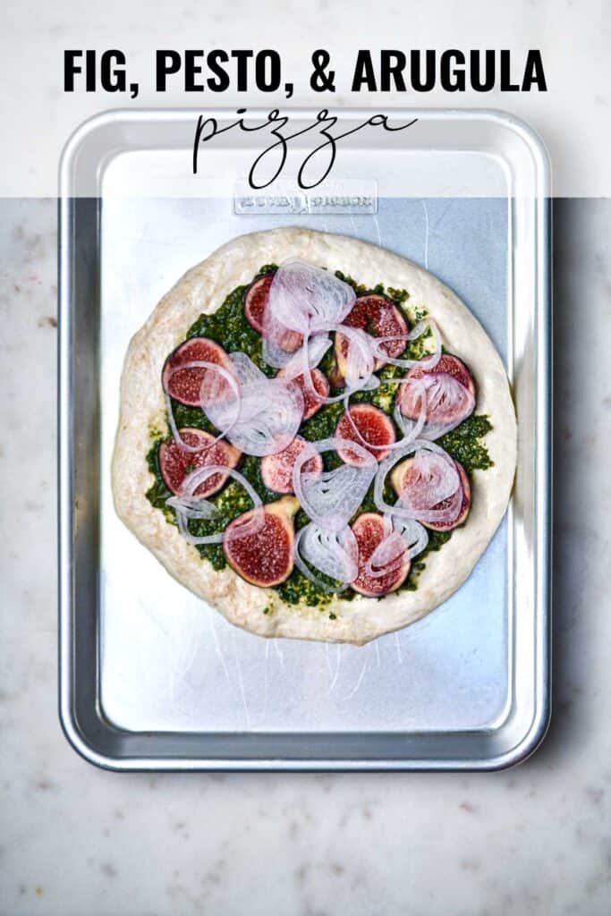 Fig pizza on a baking sheet with title text.