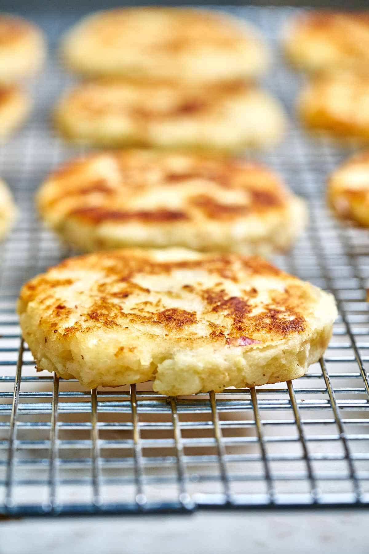 Close up of a latke on a wire rack.