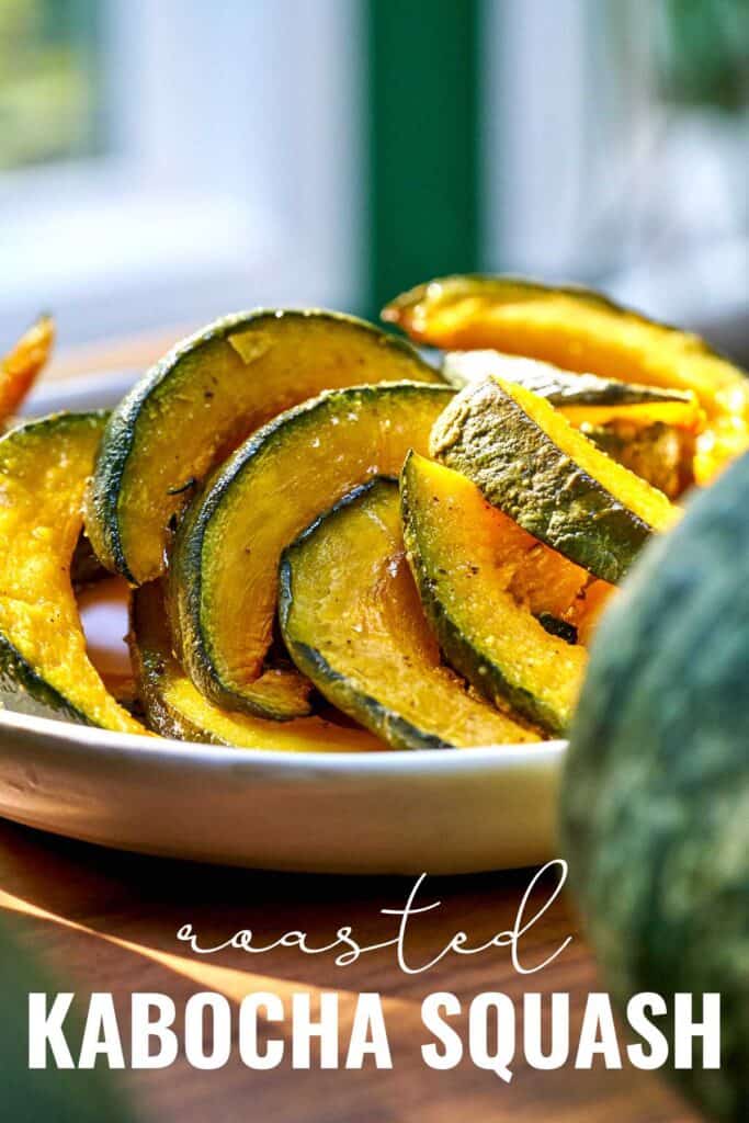Roasted kabocha squash on a white plate on a wood table with title text.