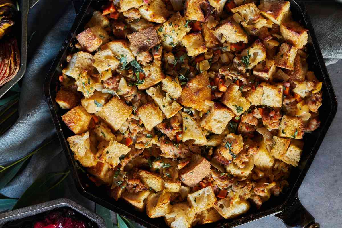 Cast iron pan with bread and sausage stuffing.