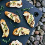 Crostini on a cutting board.