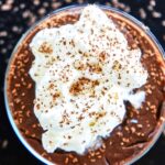 Top of chocolate pudding with whipped cream.