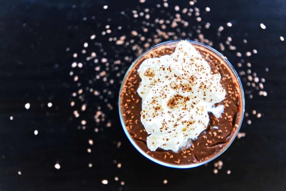 Top of chocolate pudding with whipped cream.