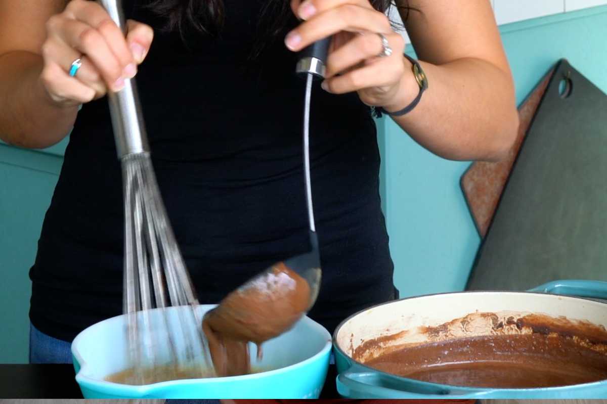 Pouring chocolate mixture into bowl.