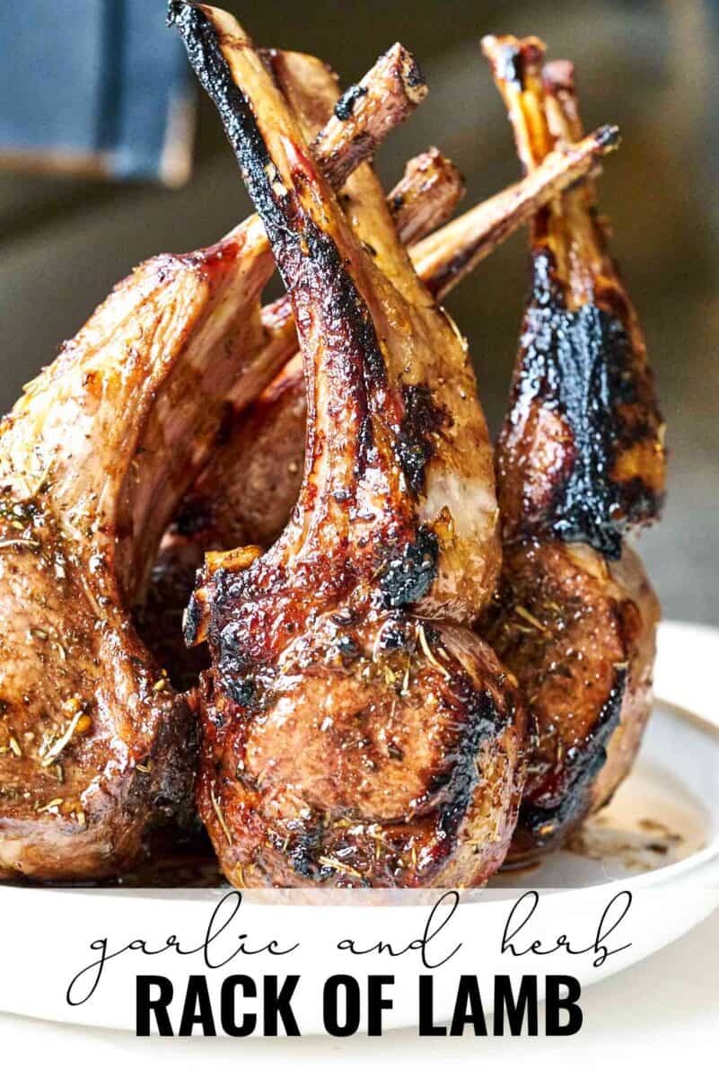 Rack of lamb standing upright on a plate.