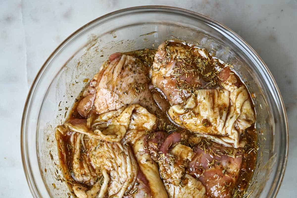 Raw chicken in marinade.