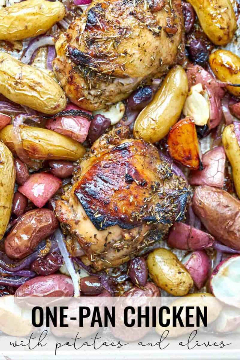 Cooked chicken and potatoes on a sheet pan.