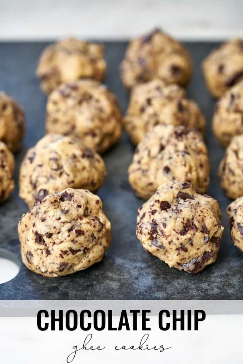 Cookie dough balls on a cutting board.