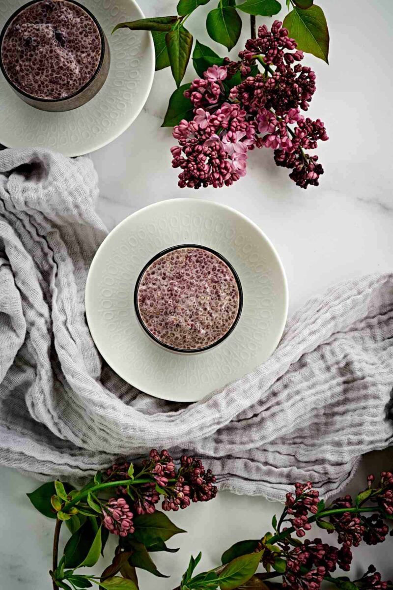 Chia pudding in a cup with flowers.