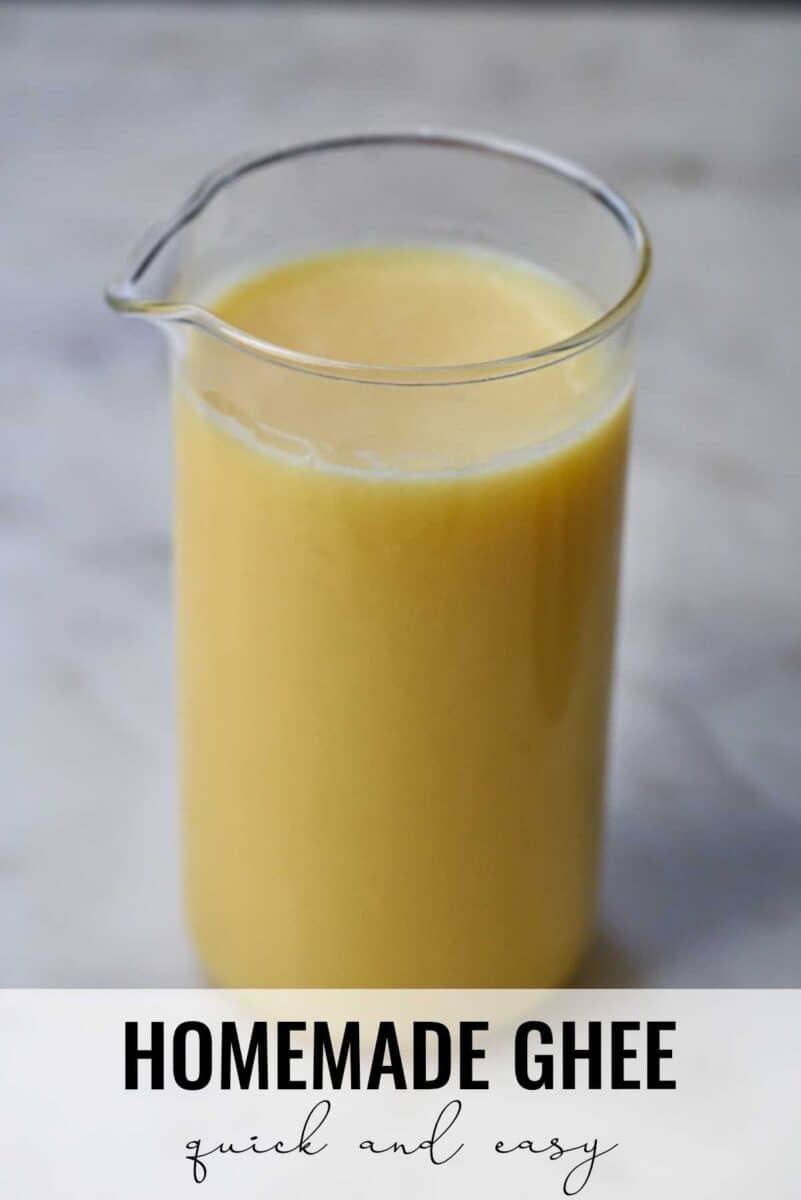 Ghee in a glass with a spout.