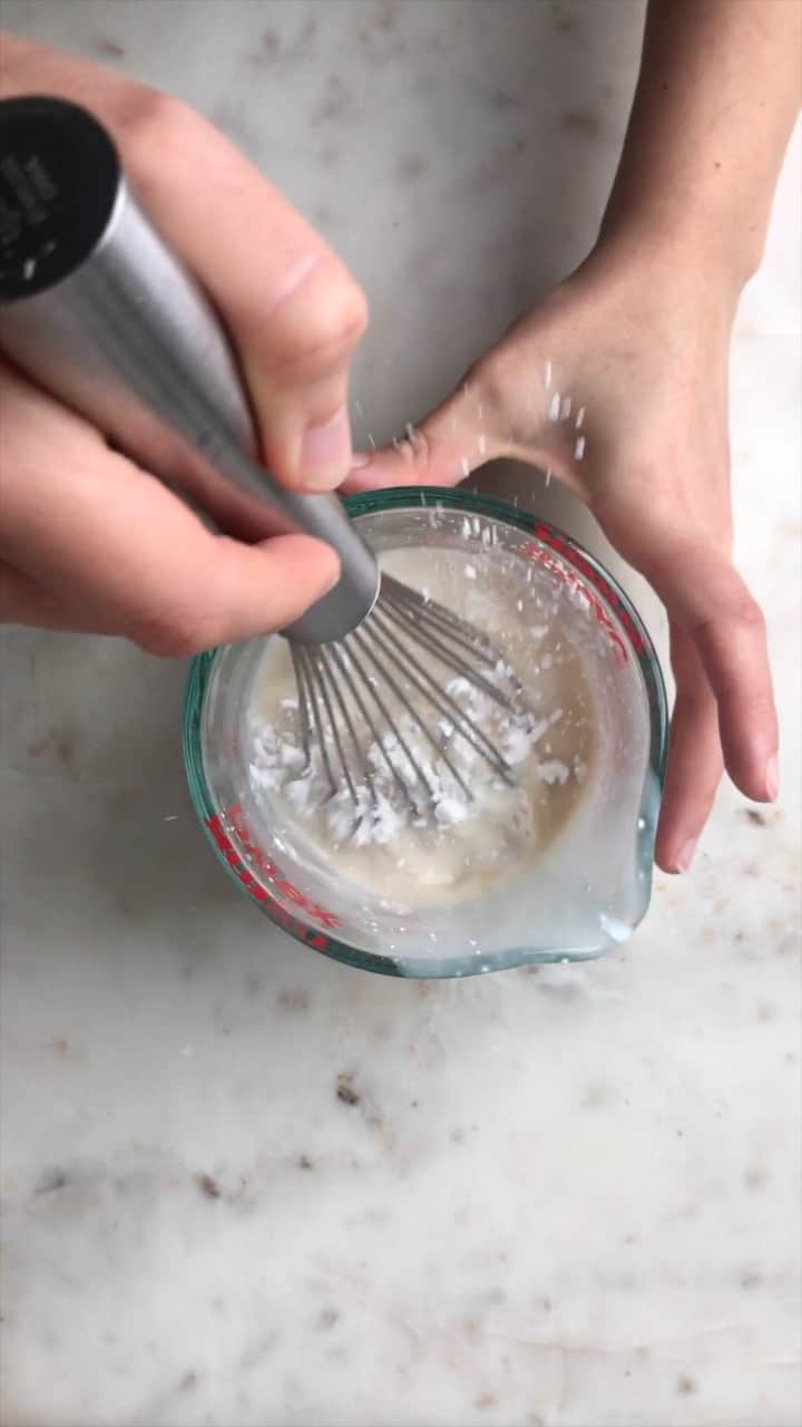 Whisking ingredients in a liquid measuring cup.