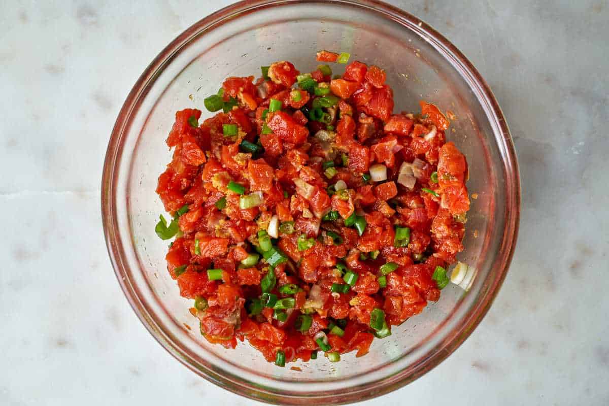 Diced salmon in a bowl.