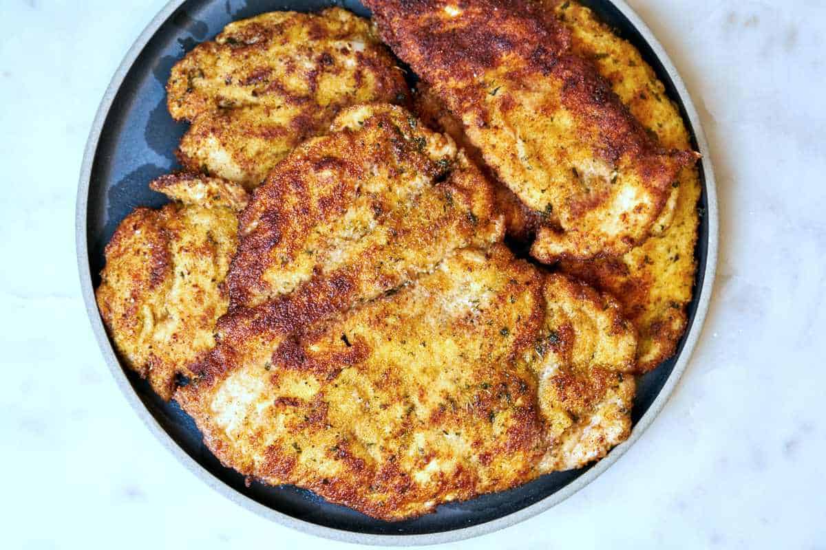 Stack of schnitzel on a plate.