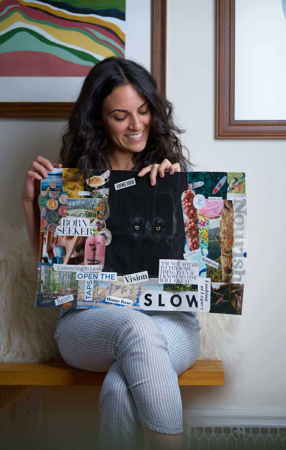 Woman holding a vision board.