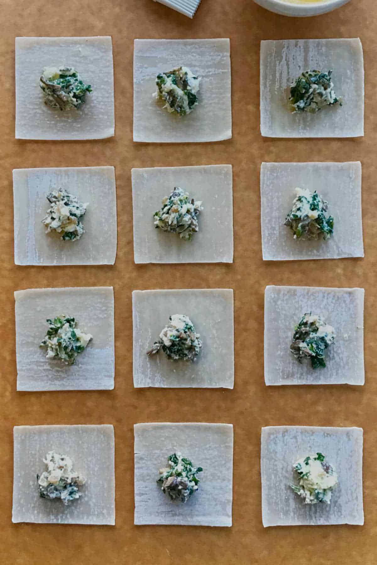 Ravioli on a baking sheet.