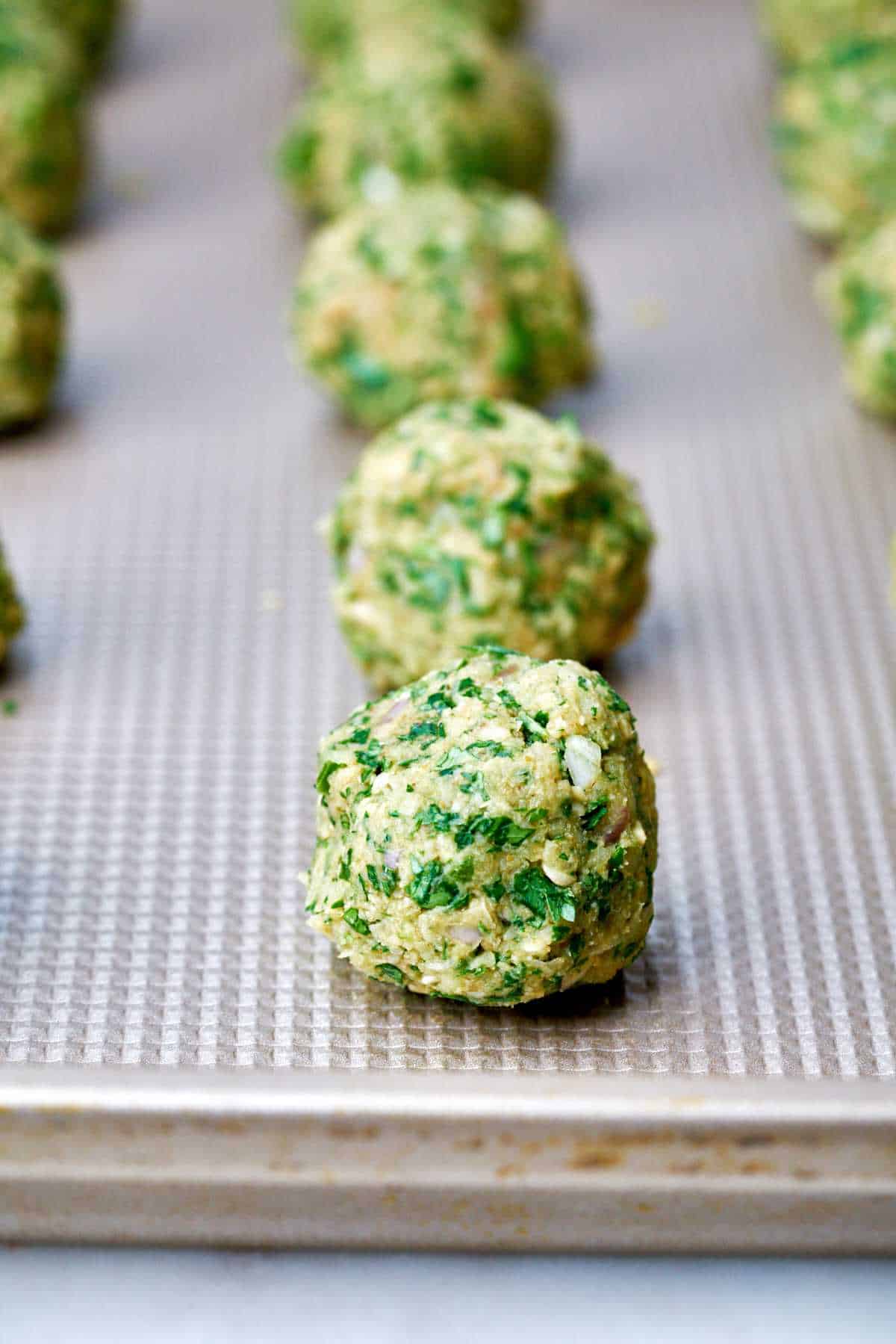 Falafel on a baking sheet.