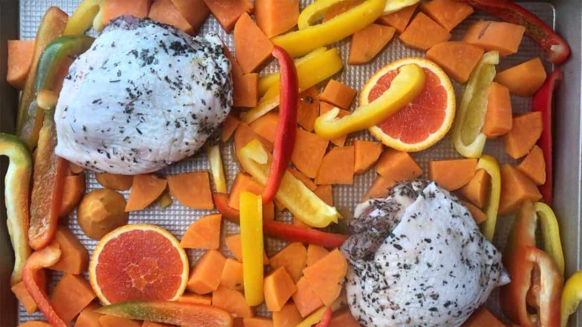 Sheet pan with chicken and vegetables.