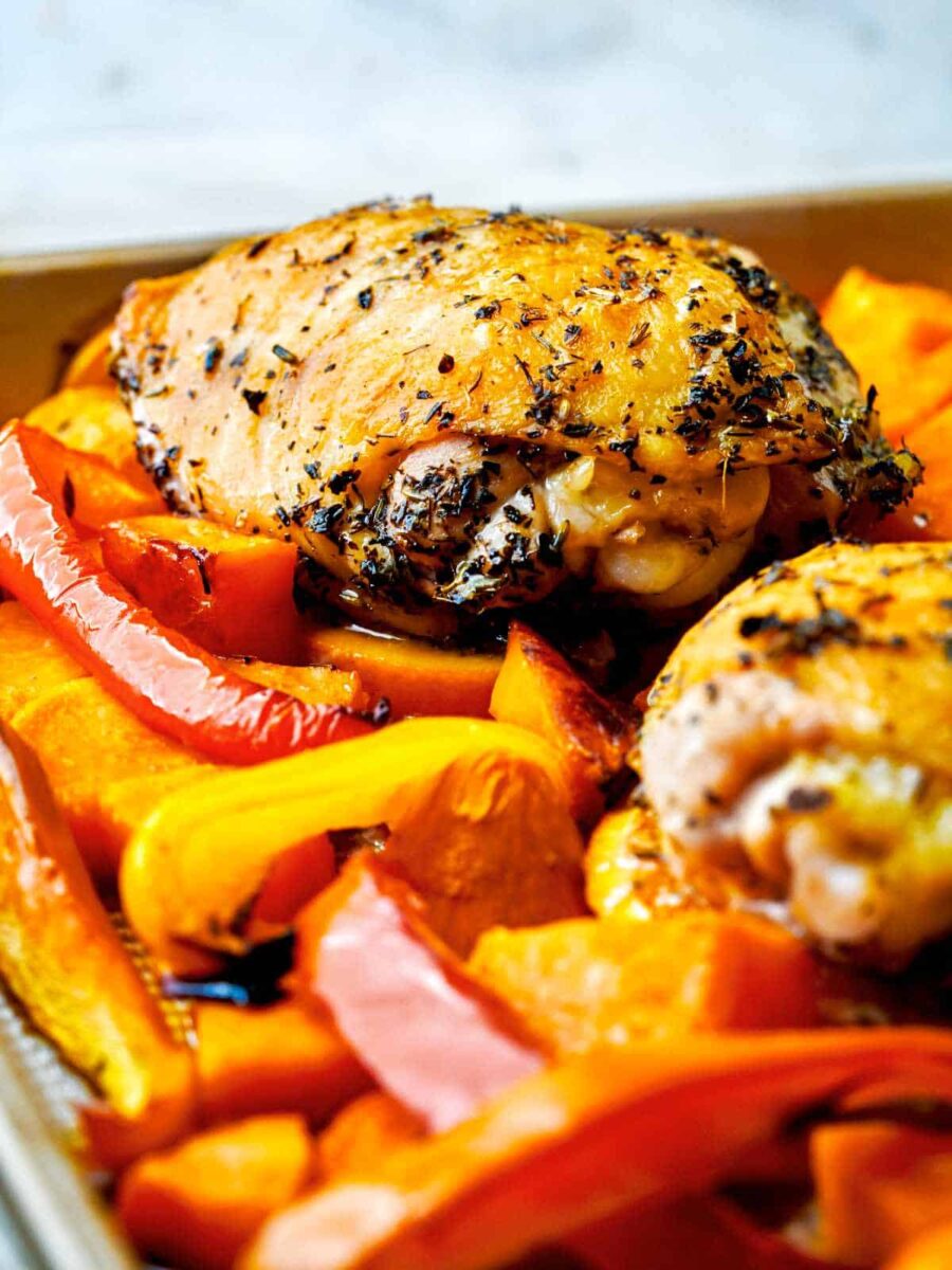 Sheet pan with chicken and vegetables.