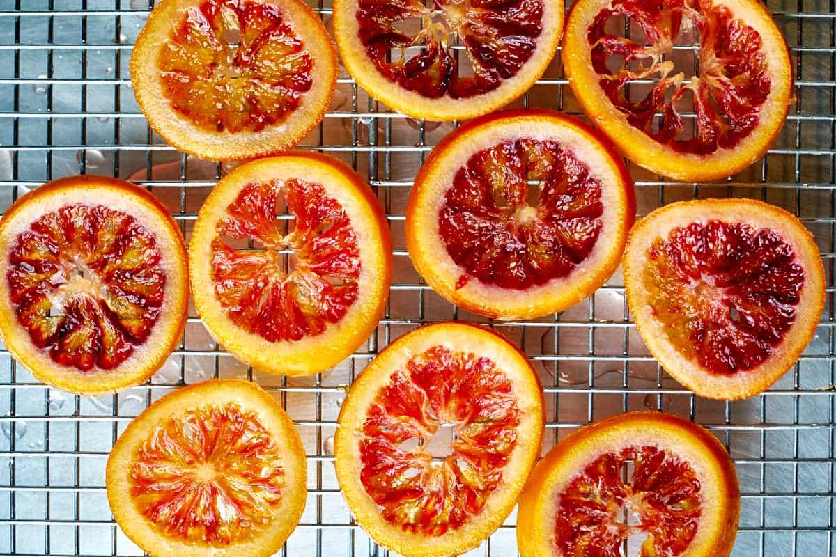 Orange slices on a wire rack.