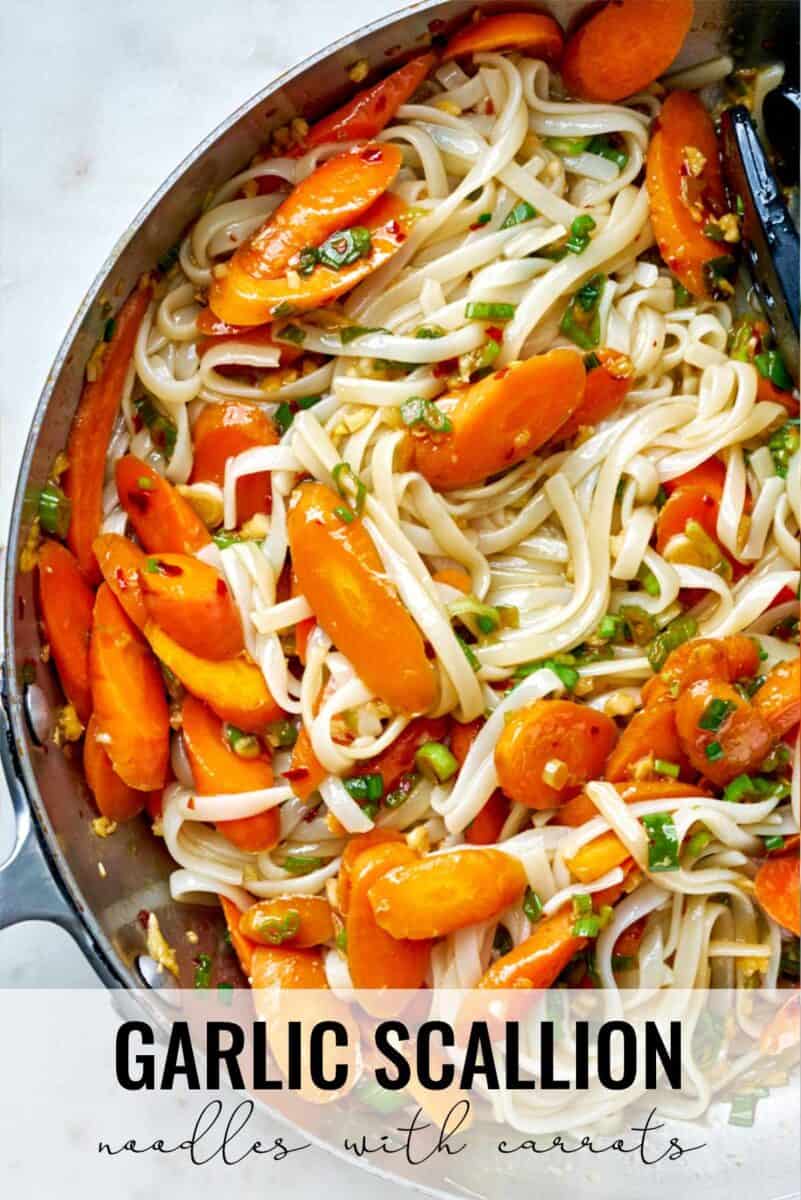 Noodles with carrots in a pan.