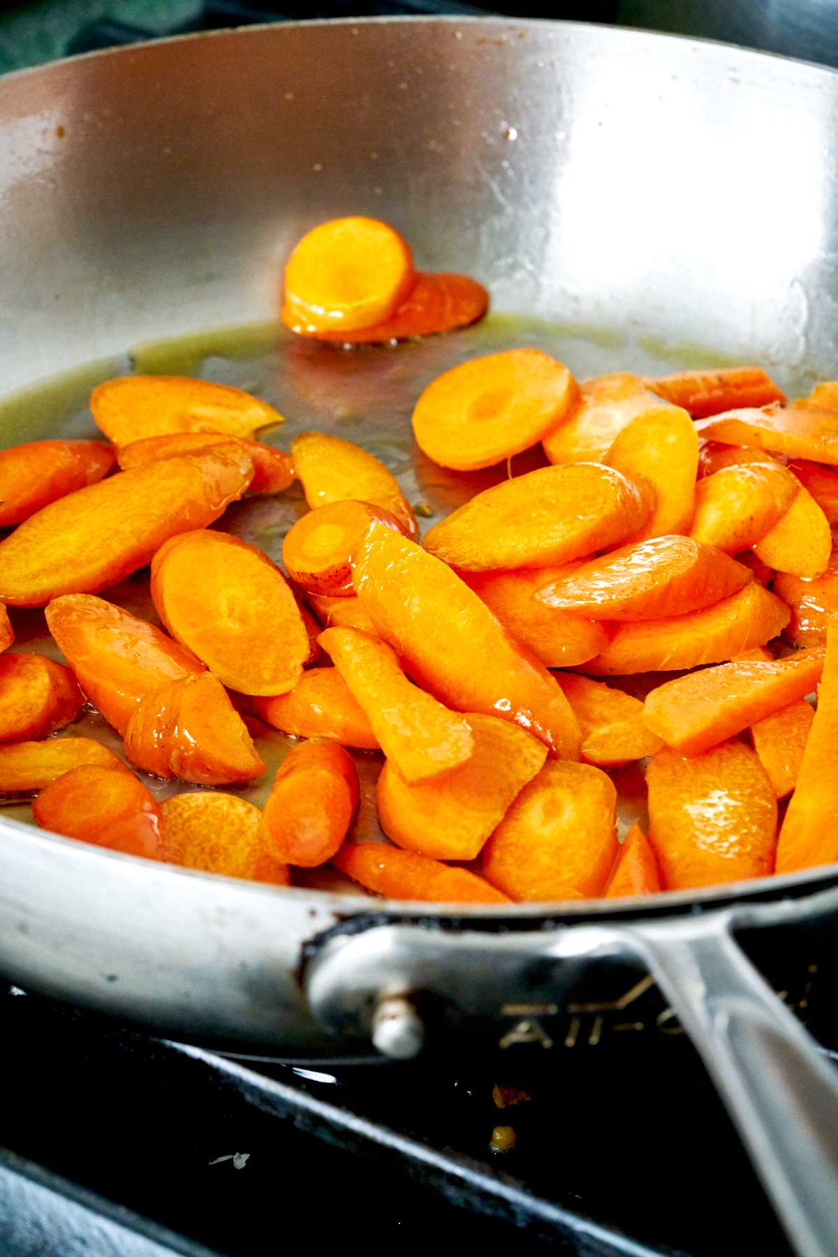 Carrot slices in a pan.