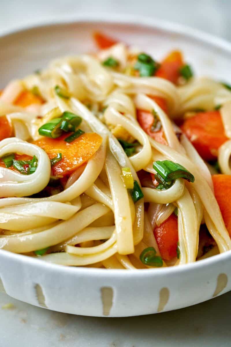 Noodles with carrots in a bowl.