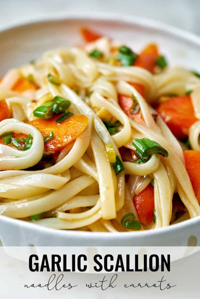 Noodles with carrots in a bowl.