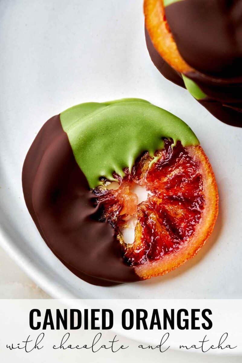 Orange slices dipped in chocolate and green chocolate.