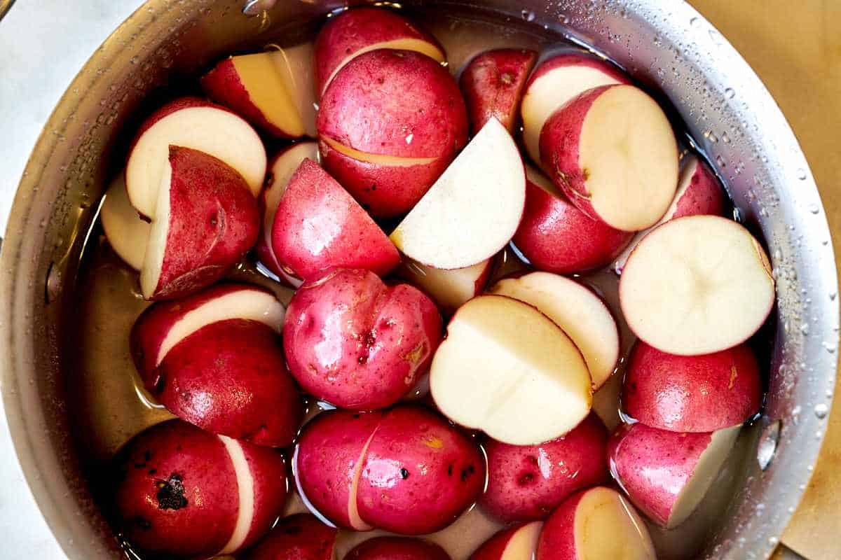 Pot of cut potatoes.