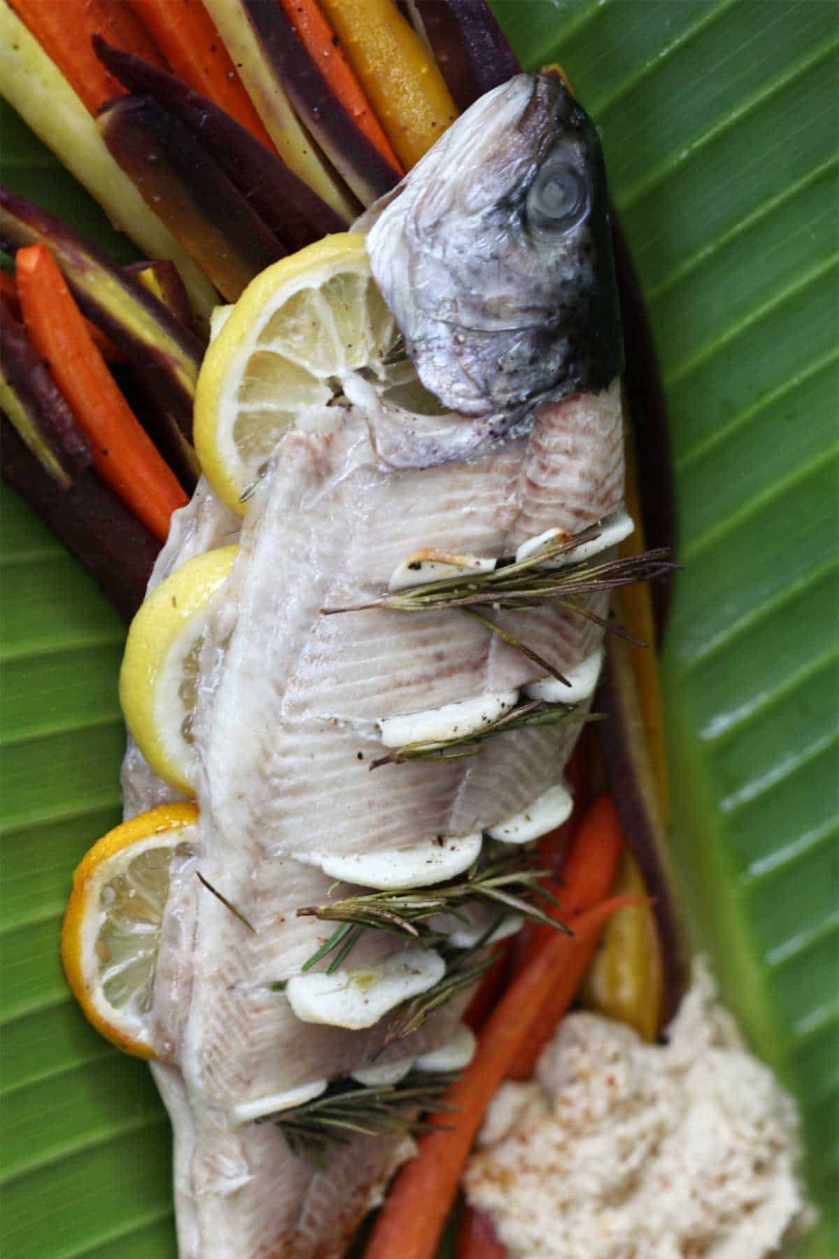 Whole trout with lemon slices.