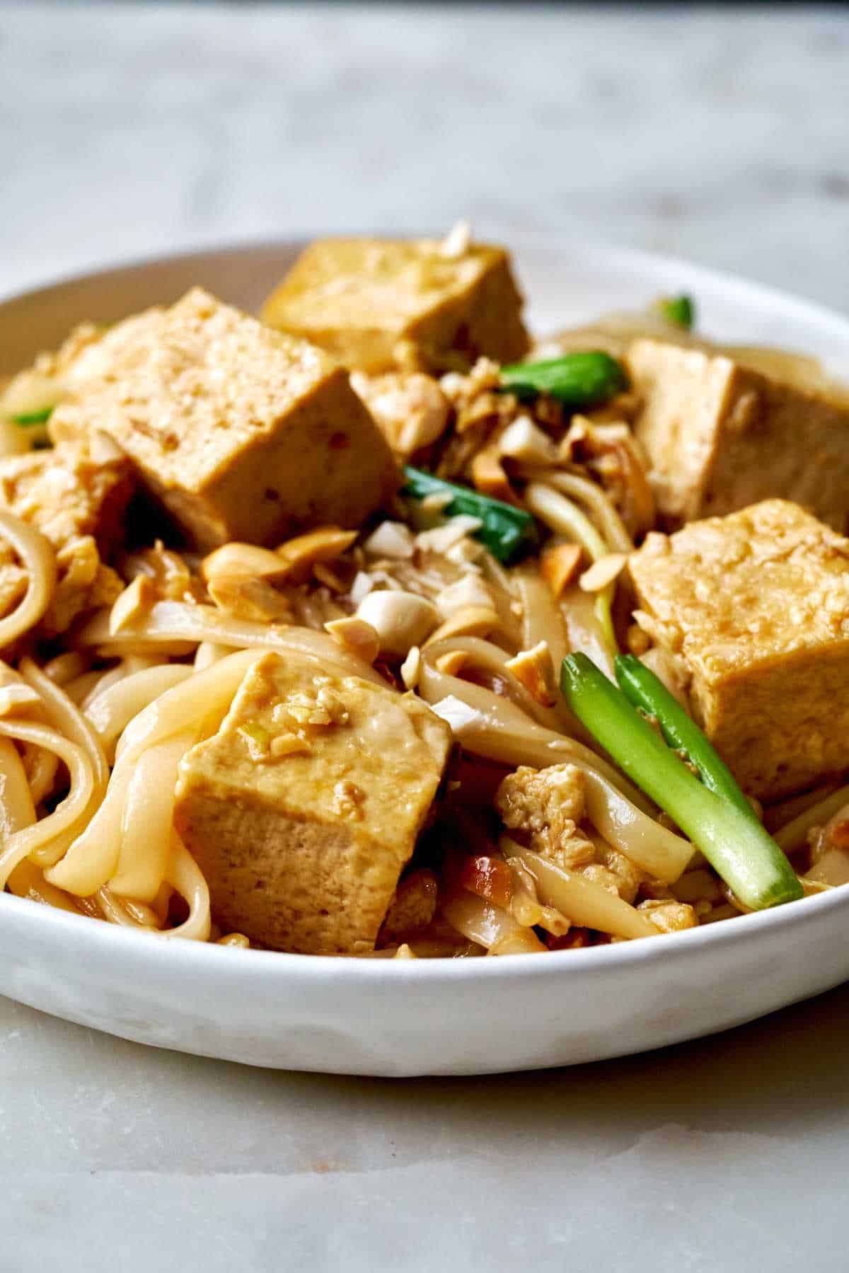 Plate with noodles and tofu.