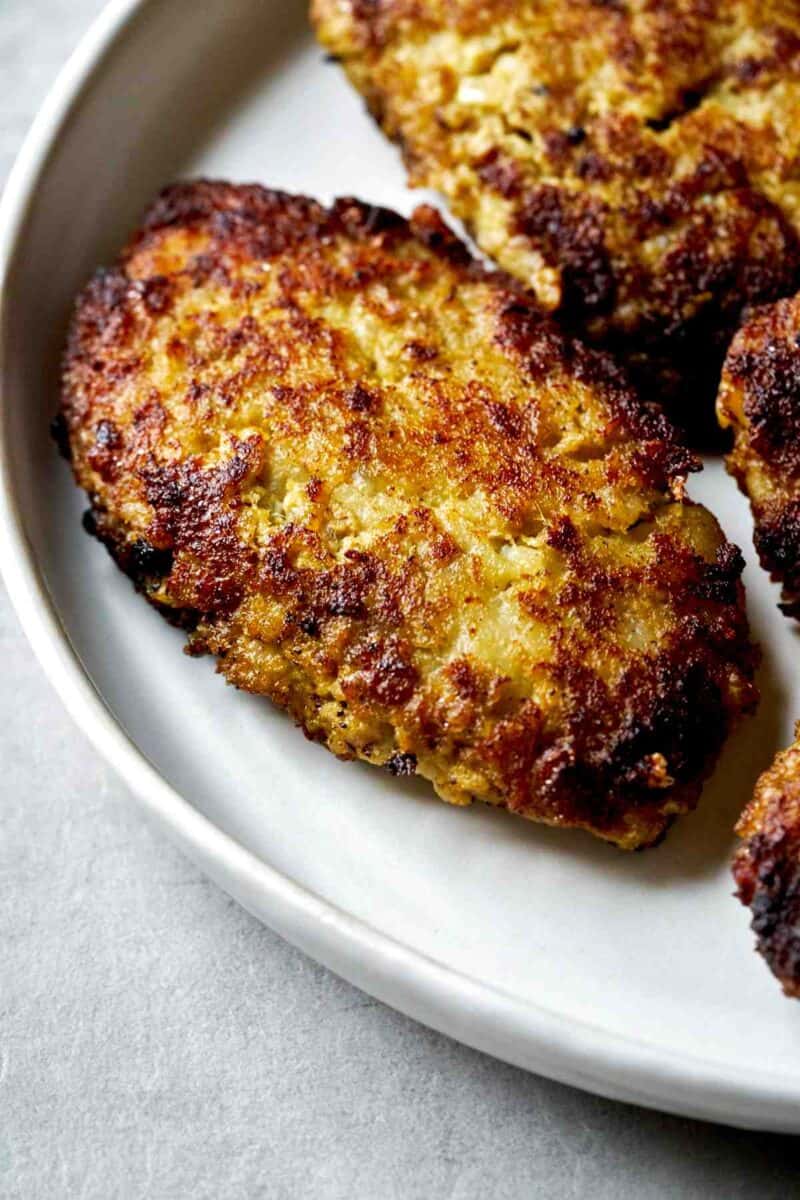 Meat patties on a plate.