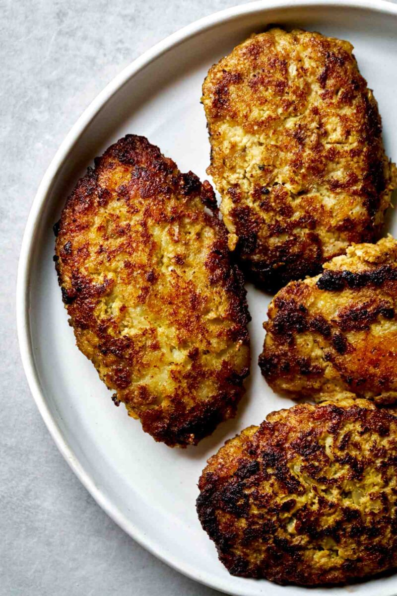 Meat patties on a plate.